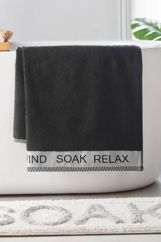 Catherine Lansfield 'Relax & Unwind' Towel in Black Black