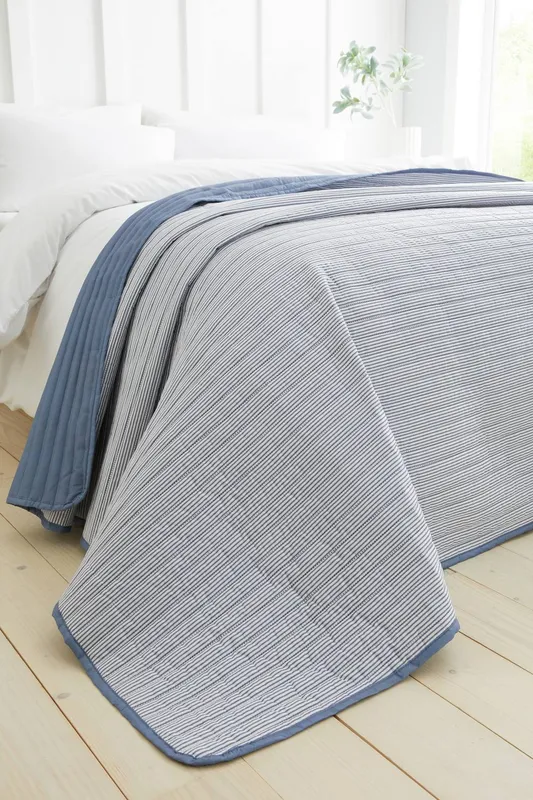 Catherine Lansfield 'Stripe' Quilted Reversible Bedspread in Blue - Blue