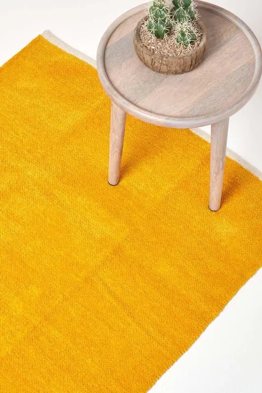 Homescapes 100% Cotton Plain Chenille Rug in Mustard Size: 90 cm x 150 cm Mustard 90 cm x 150 cm