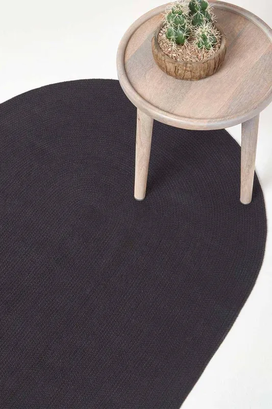 Homescapes Handmade Woven Braided Oval Rug in Black Size: 110 cm x 170 cm Black 110 cm x 170 cm