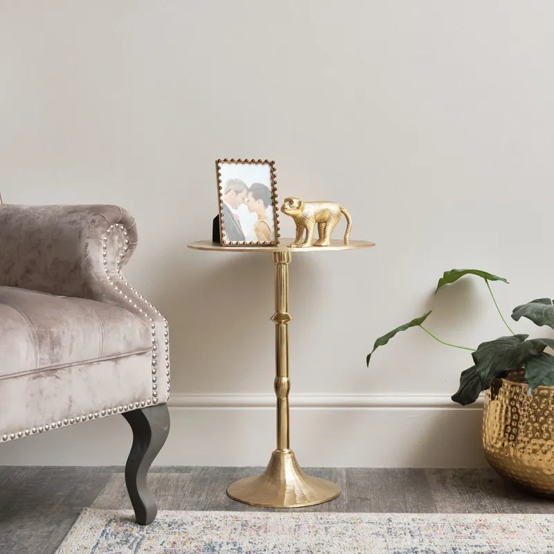 Melody Maison Round Gold Metal Side Table in Metallic Gold Metallic Gold
