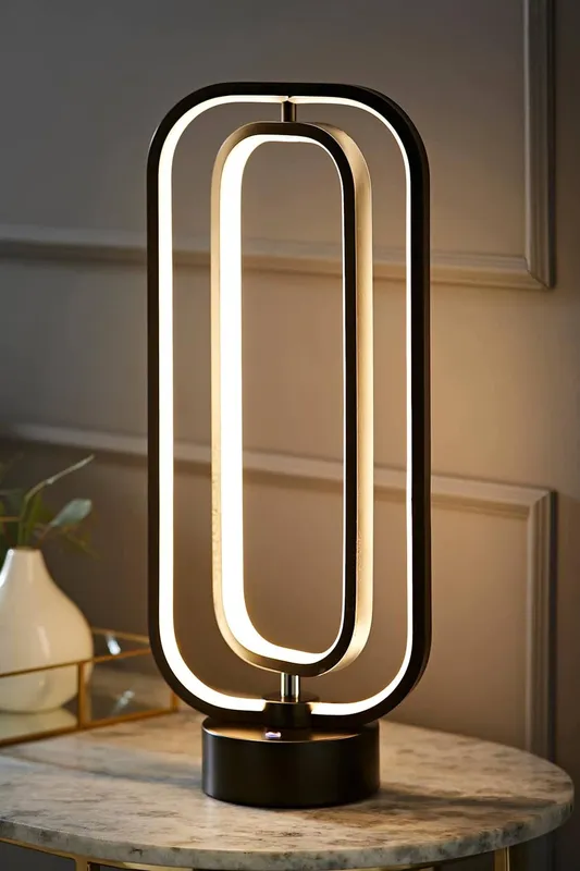 ValueLights Unisex Infinity Matte Black Revolving Integrated LED Table Lamp Black female